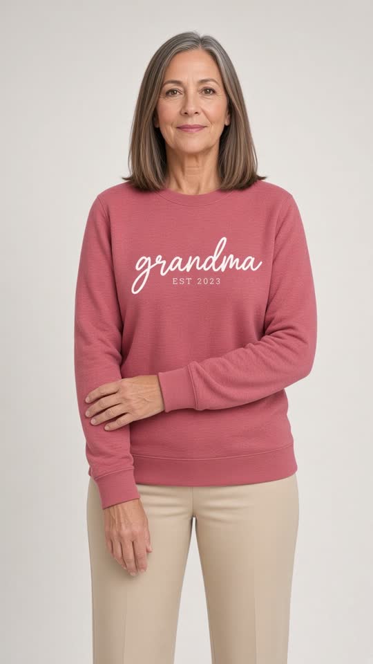 AI model wearing the pink grandma sweatshirt from the original folded product photo